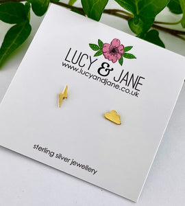 gold mismatched lightning bolt and cloud studs on a white card