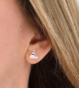 sterling silver colourful sailboat earrings in models ear