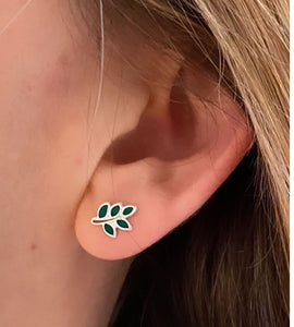 sterling silver mini leaf climber earrings in model's ear