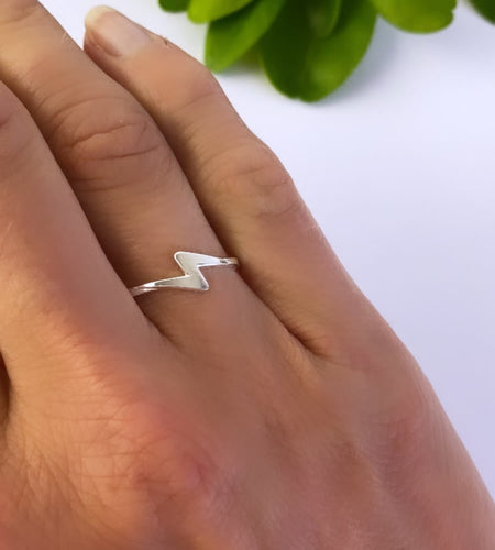 sterling silver lightning bolt ring on model's finger