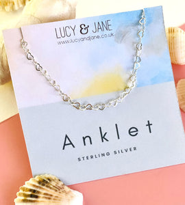 sterling silver linked hearts anklet on a backing card
