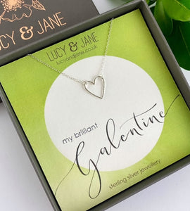 sterling silver simple heart necklace on a galentine card