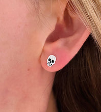 Load image into Gallery viewer, sterling silver skull studs on model&#39;s ear