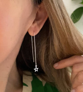 sterling silver star threaders in model's ear