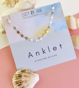 sterling silver multi stars anklet on a backing card