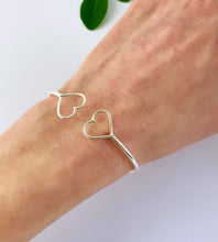 Load image into Gallery viewer, sterling silver double heart open bangle on model