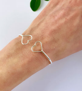 sterling silver double heart open bangle on model