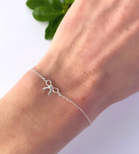 Load image into Gallery viewer, sterling silver bow bracelet on model