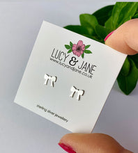 Load image into Gallery viewer, sterling silver bow studs on a Lucy and Jane earring card