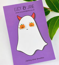 Load image into Gallery viewer, little pumpkin studs with devil horns and tails on a Halloween themed backing card