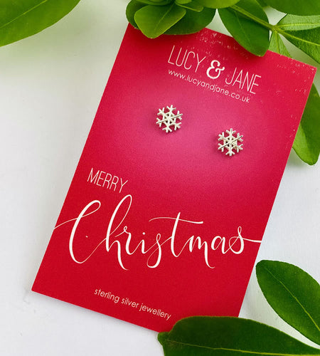 sterling silver snowflake studs on a merry Christmas card