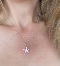Load image into Gallery viewer, sterling silver starfish necklace on model