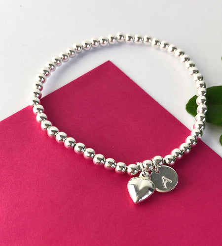 sterling silver stretch heart bracelet personalised with an initial charm